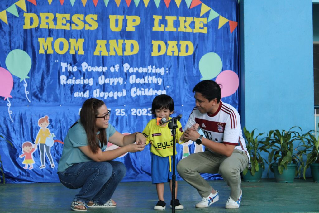 Preschoolers dressed up like their mom or dad and introduced themselves to the audience.